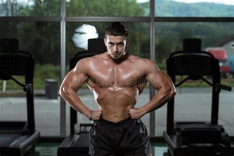 Male Bodybuilder Flexing Muscles Stock Photo Image Of Health