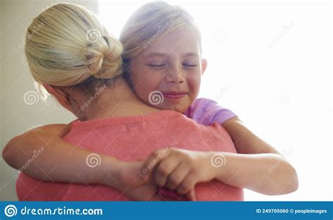 I Love You So Much A Cute Little Girl Hugging Her Mom With A Happy
