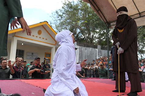 Indonesian Man Faints During Caning Revived And Caned Again Photos