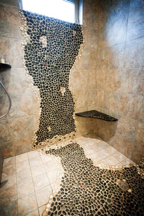 Doorless shower with river rock floor, rain showerhead, river rock deco band creates a very therapeutic environment in this bathroom. River Rock Shower Wall | The master bath was designed with ...