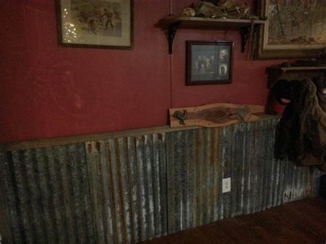 Its golden appearance also makes tin the perfect finish for decorative purposes. Old tin as wainscoting with deep red walls | Barn tin, Tin walls, Decor