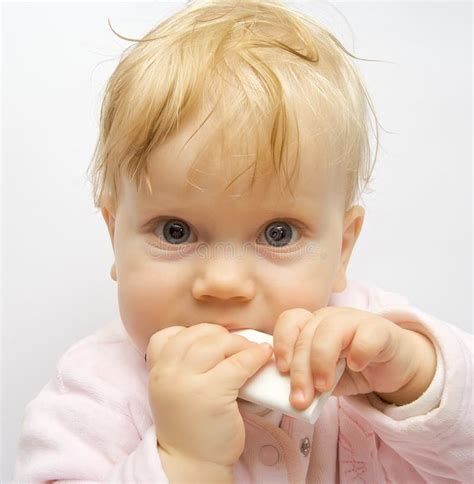 Baby Eating Remote Control Stock Photo Image Of Holding 12156138