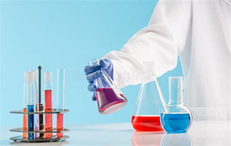 Experiments In A Chemistry Lab Conducting An Experiment In The