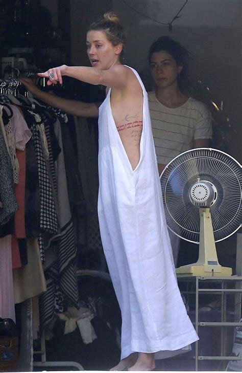 Amber Heard Has Wardrobe Malfunction In Loose Fitting Dress Photos Geelong Advertiser