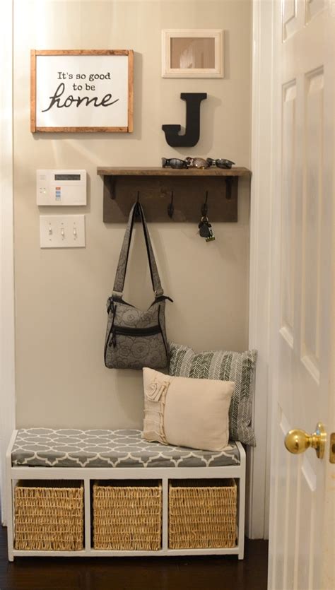 This wall mounted rack is simply wood molding and pretty brass hooks. Mudroom gallery wall + DIY coat rack shelf