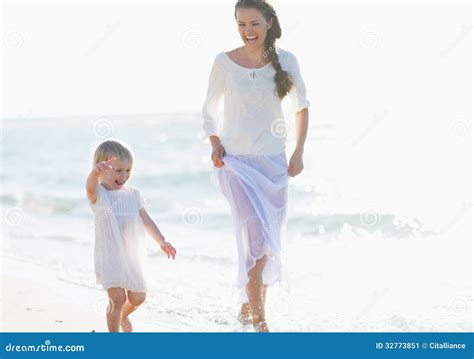Happy Mother And Baby Walking Along Sea Coast Stock Image Image Of