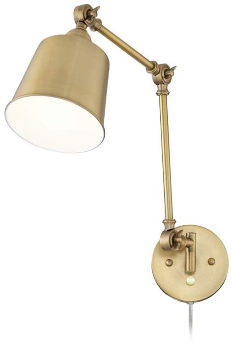 An Antique Brass Swing Arm Wall Light With A White Shade On The Top And