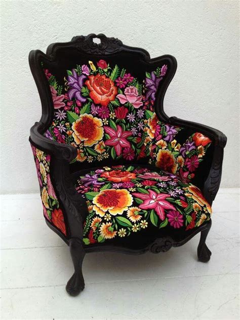 An Ornate Chair With Flowers Painted On It S Back And Arms Sitting In