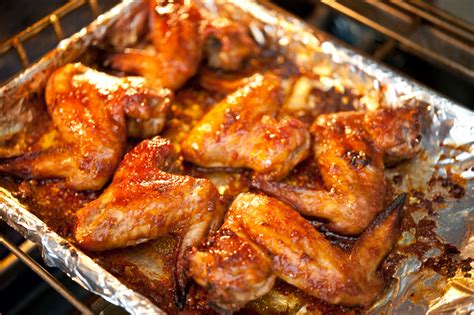 Crispy baked chicken wings with honey and spices. Oven Baked Wings with Sweet BBQ Sauce | Tasty Kitchen Blog