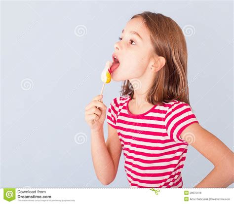 Little Girl Licking A Lollipop Royalty Free Stock Photos Image 28675418