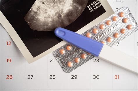 Premium Photo Pregnancy Test And Birth Control Pills With Ultrasound