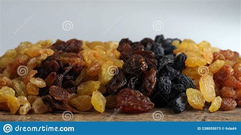 Seven Different Varieties Of Raisins Are Placed In Rows Stock Image