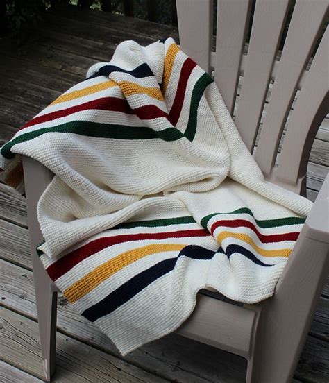 Native americans aren't generally associated with sheep, especially not sheep dotted about the limestone villages of the english cotswolds. I knitted this beauty ..... Hudson Bay lap blanket ...