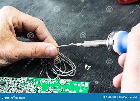 Soldering Iron And Solder In The Hands Of A Man Stock Image Image Of