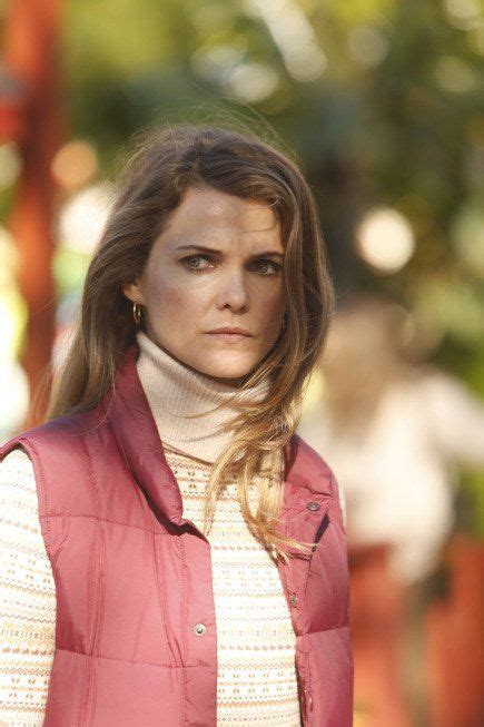 keri russell in a fair isle sweater and a puffer vest in the americans season 2 elizabeth