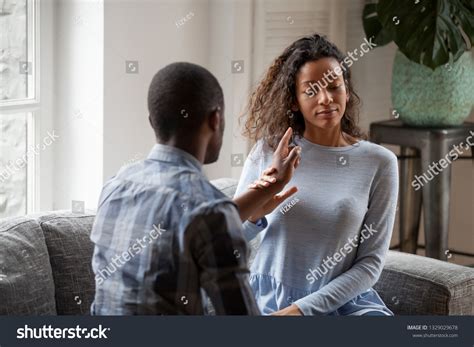 Young Mixed Race Couple Sit On Stock Photo 1329029678 Shutterstock
