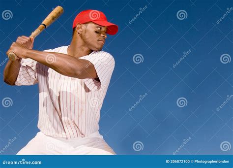 Portrait Of Baseball Batter Hitting The Ball Stock Photo Image Of