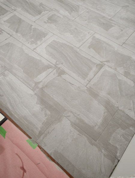 It is important to set allow your ceramic tile bathroom to set for 24 hours before carrying out the final step. Laying Porcelain Tile In The Laundry Room | Tiles, Tile ...