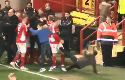 Watch Arsenal Loanee Krystian Bielik Get Taken Out By Charlton Pitch Invader Who Slipped Amid