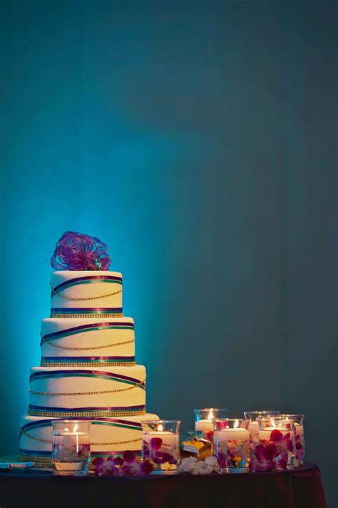 Tiered Purple Gold And Teal Wedding Cake
