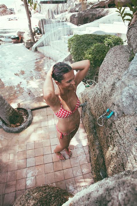 Nude Woman Taking Shower In Tropical Spa Del Colaborador De Stocksy
