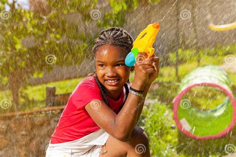 Girl In Active Offensive Pose Play Water Gun Fight Stock Image Image
