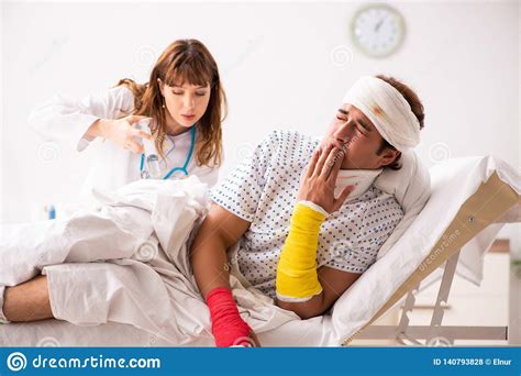 The Young Doctor Examining Injured Patient Stock Photo Image Of Neck