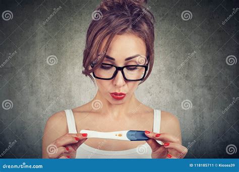 woman shocked cannot believe her eyes while checking positive pregnancy test stock image image