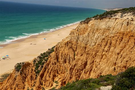 The beaches of portugal's silver coast, costa da prata, are a surfer's dream and often overlooked in the beaches of portugal worth visiting. THE PERFECT BEACH VACATION IN COMPORTA PORTUGAL - You Should Go Here