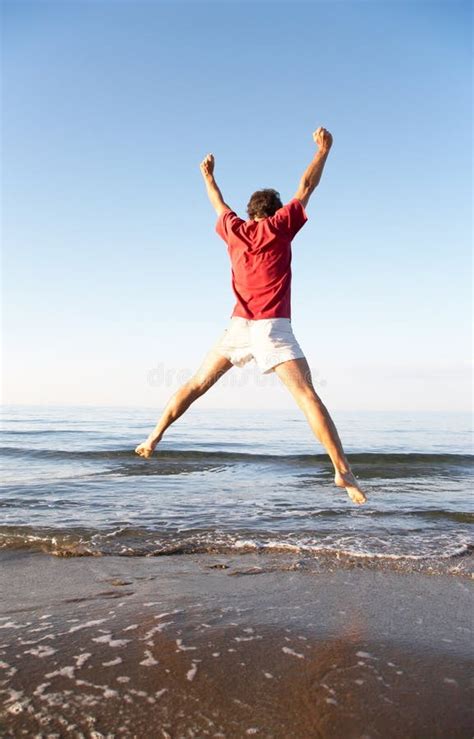 Man Jumping On The Beach Stock Image Image Of Summer 6324465