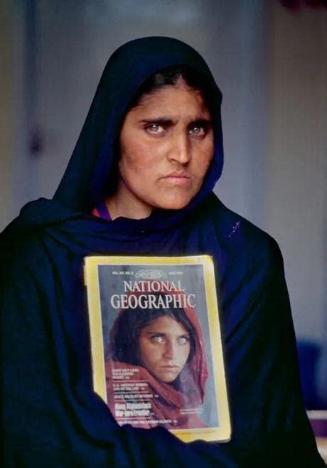 sharbat gula national geographic s the afghan girl in 2022 holding the 1984 issue with her