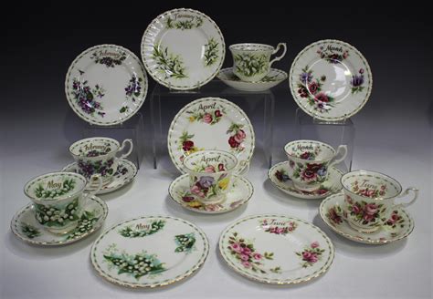 A Set Of Twelve Royal Albert Flower Of The Month Series Trios Comprising Teacup Saucer And Side Pl