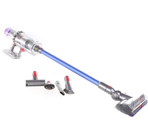 The postman holds a typical battery vacuum cleaner package under his arm. DYSON V11 Absolute Cordless Vacuum Cleaner. N.B. Not ...