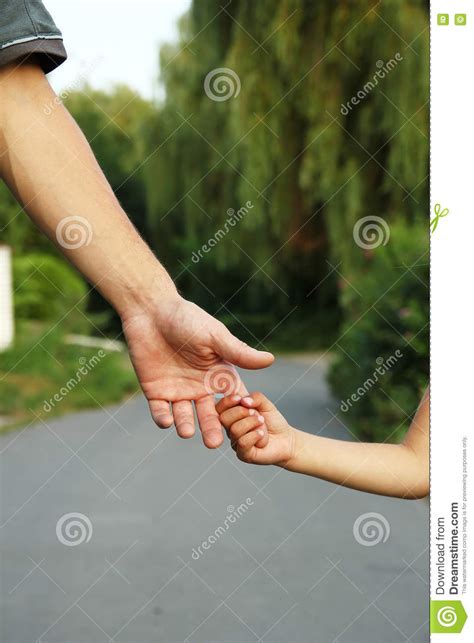 Parent Holds The Hand Of A Small Child Stock Photo Image Of Care