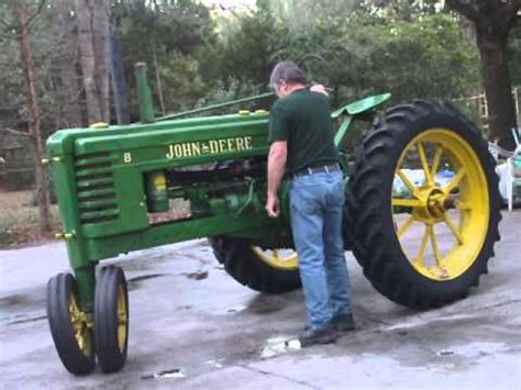 Check the parking brake that it is in the set position. Hand starting a 1939 John Deere Model B by turning the flywheel. - YouTube