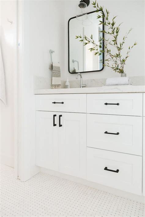Image © usiremodeling.com another thing you can match with your white shaker cabinets is a black island. Simply White Benjamin Moore Bathroom features white shaker ...