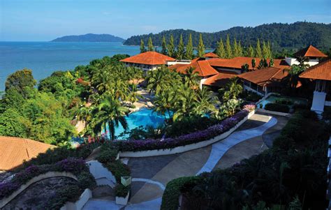 Guests enjoy the beach locale. Review Hotel Swiss-Garden Beach Resort Damai Laut, Lumut ...