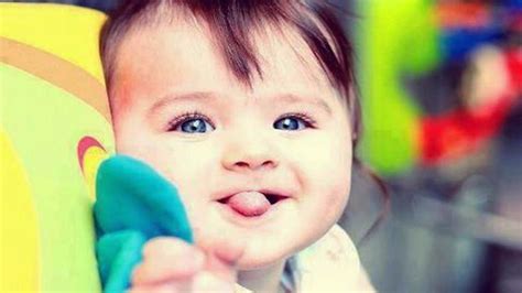 Blue Eyes Cute Funny Baby Expression In Blur Colorful Background Cute