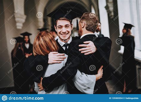 Mother Father Son Hugs University Graduates Stock Photo Image