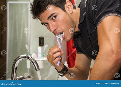 Headshot Of Attractive Young Man Brushing Teeth Stock Image Image Of