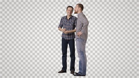 Two Men In Casual Stand Side By Side Discuss Laugh Front View