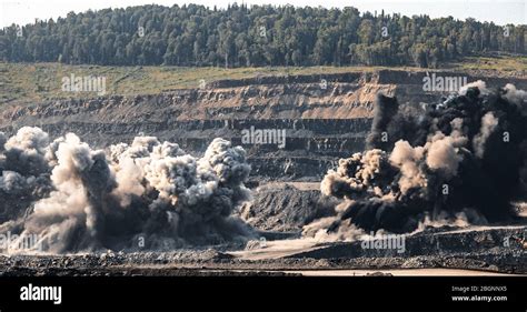Explosive Works On Open Pit Coal Mine Industry With Dust And Puffs Of