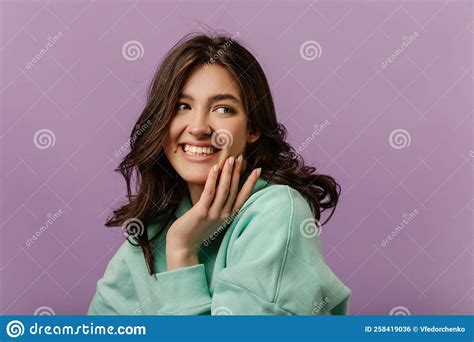 Close Up Of Young Beautiful Caucasian Girl Smiling Looking Away On