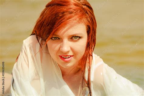 Redhead Woman Posing In Water During Summertime Stock Foto Adobe Stock