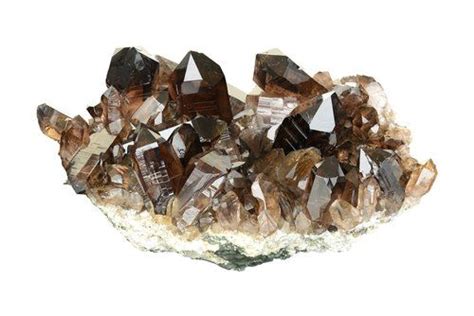 A Cluster Of Crystals Sitting On Top Of A Rock