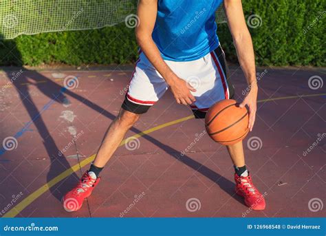 Young Man Athlete On Basketball Court Dribbling Stock Photo Image Of