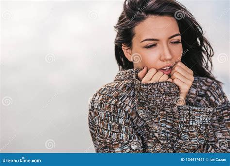 Image Of Beautiful Sad Brunette Female Posing Against Lake With Blowing