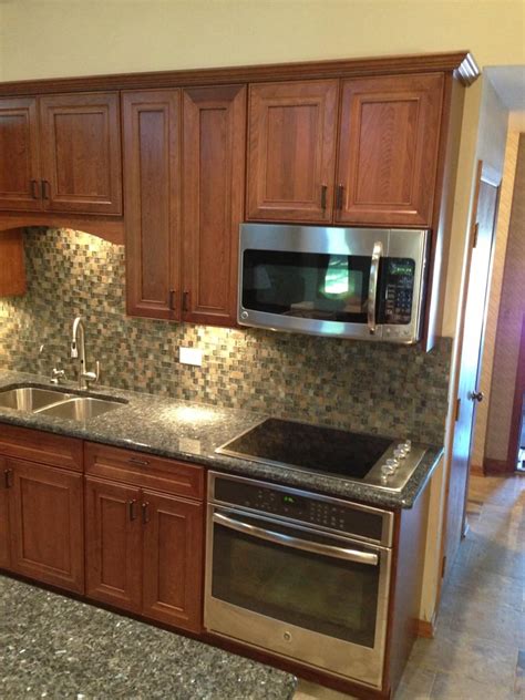 Many older dishwashers cannot be removed (or installed) if you add 3/4 flooring in front of it. Kitchen Cabinet replacement, appliance replacement, Tile back splash, Blue Pearl Granite counter ...