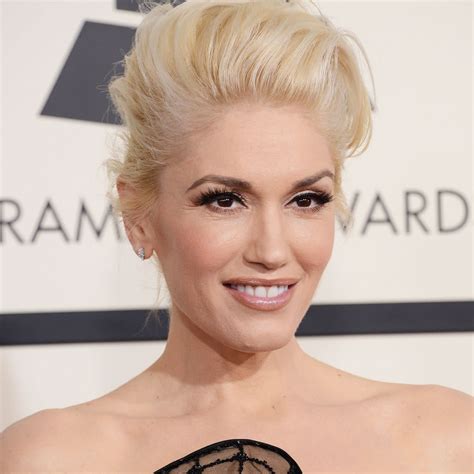 Gwen Stefani Flaunts Her Legs In A Plunging Gold Mini Dress And