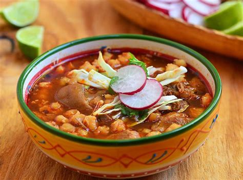 A Bowl Of Chili And Bean Soup With Radishes On The Side